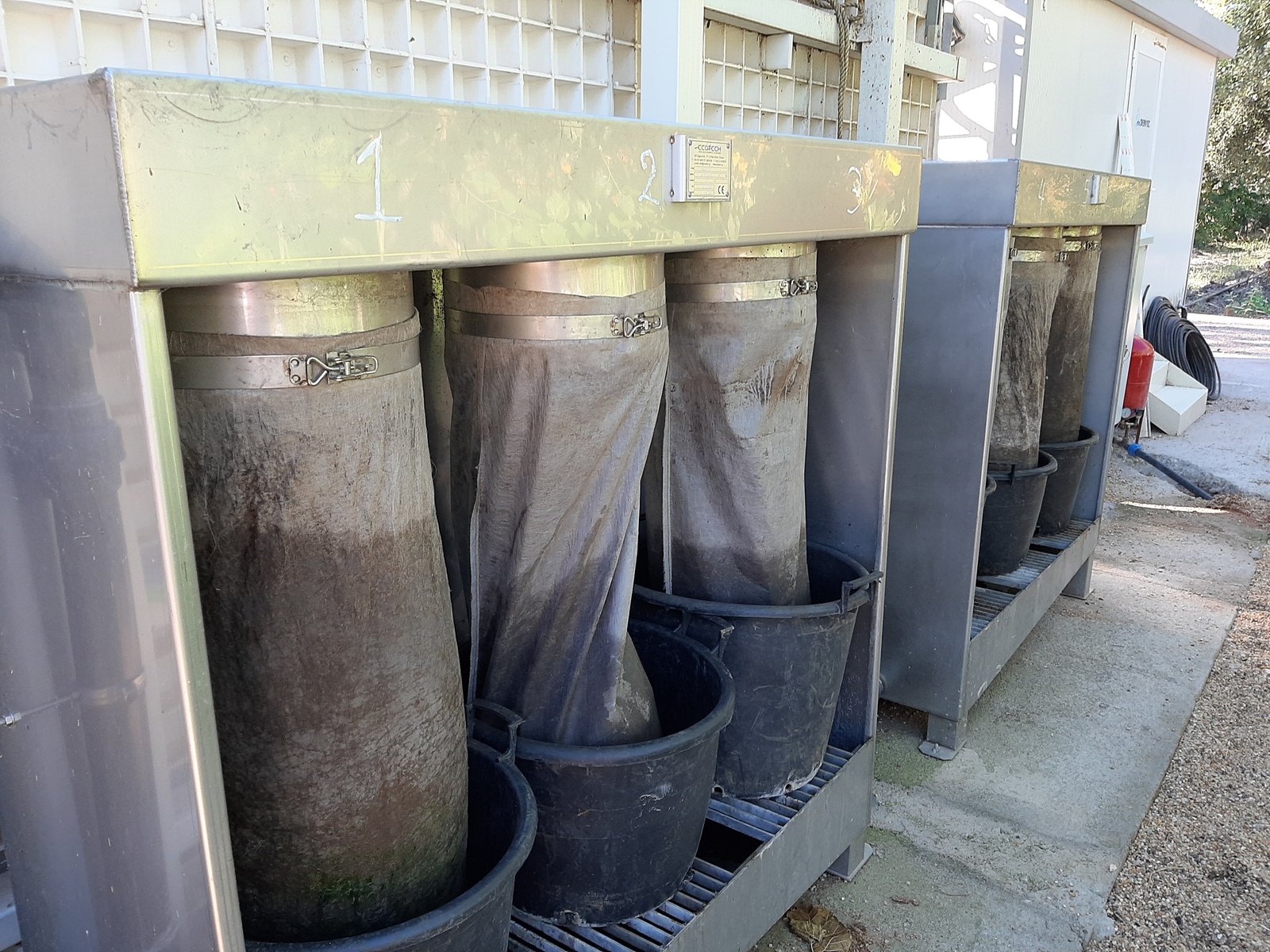 Smaller tanks full of sludge for compost production